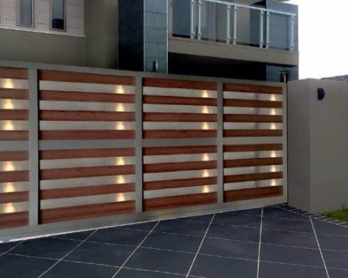 A large sliding gate of wood and aluminium.